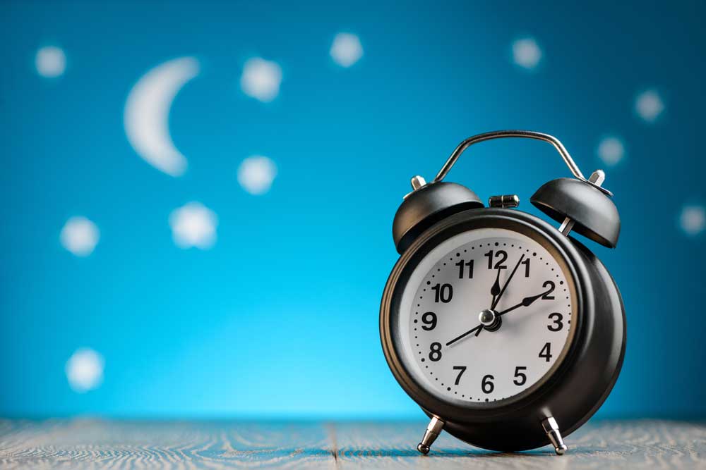 clock with blue background and stars and moon