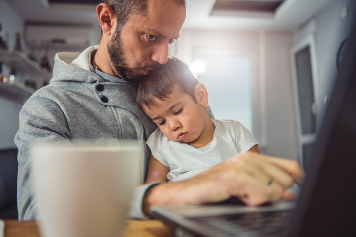 man works from home with kids